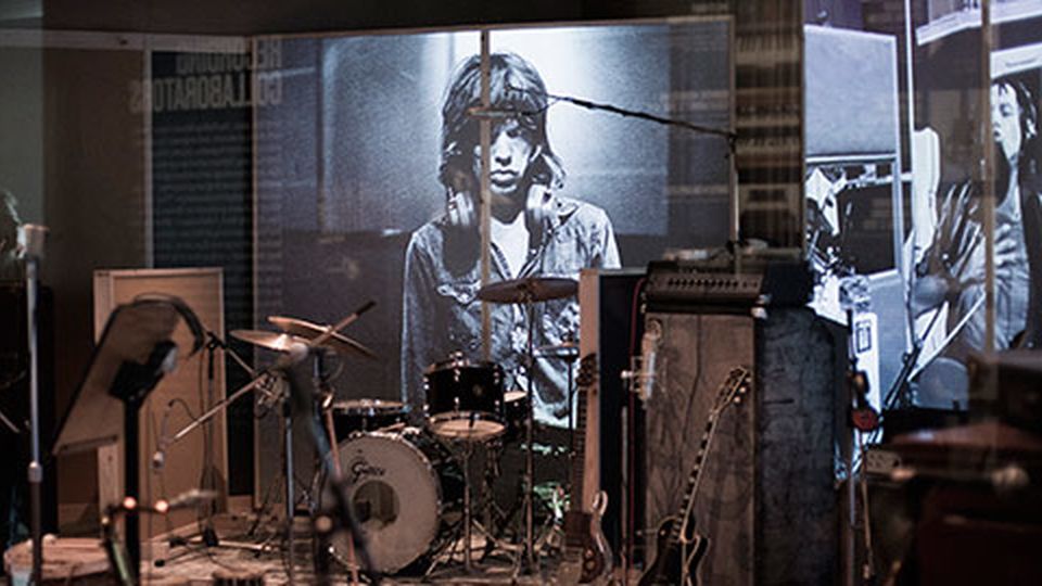 Music studio with instruments and image of Mick Jagger on one wall