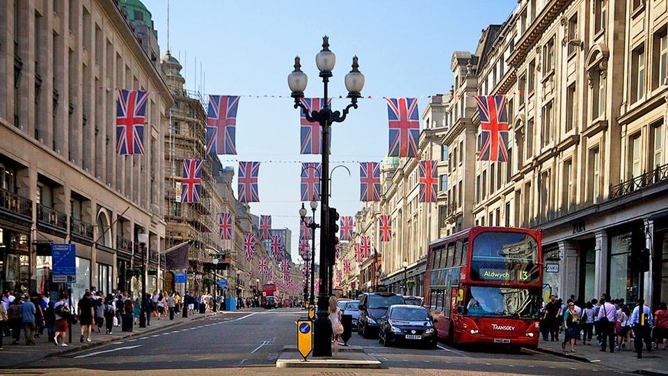 Regent Street in London, featuring red bus