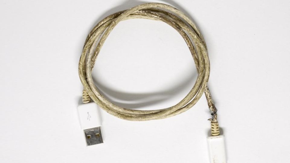 A close up image of a computer cable on a white background