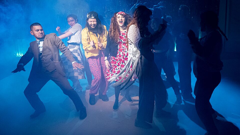 Applied Theatre students dancing in a smoke filled room