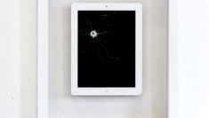 iPad with bullet hole