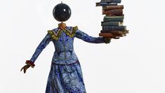 Yinka Shonibare Sculpture of a girl balancing books