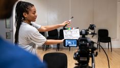 Student with a clapperboard