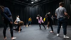 A group of students participating in a movement workshop