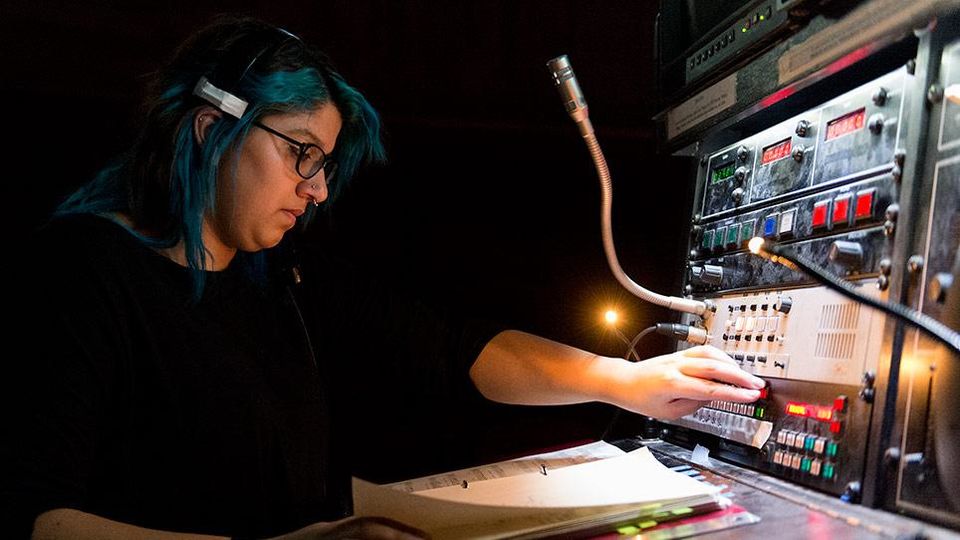Student from the Stage Management course at a soundboard