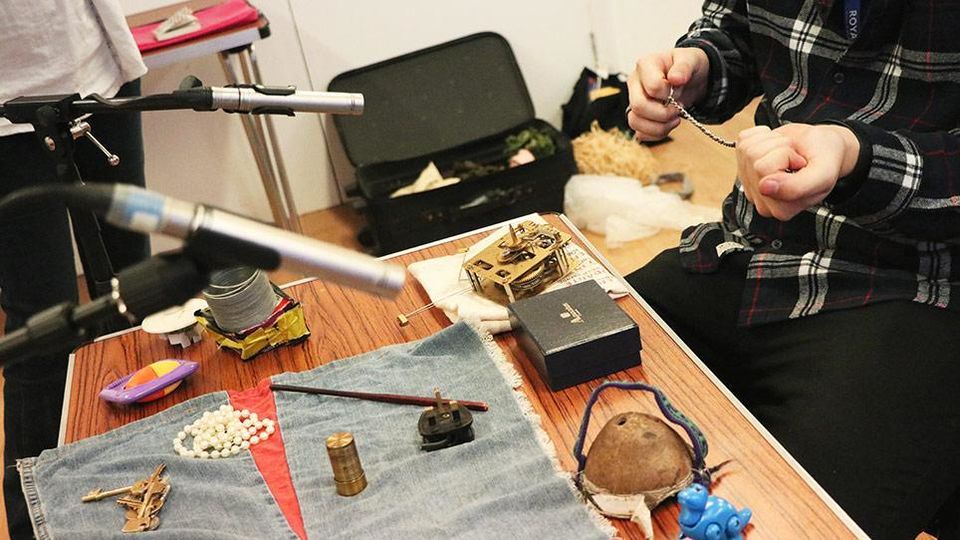 Foley artist working with various materials