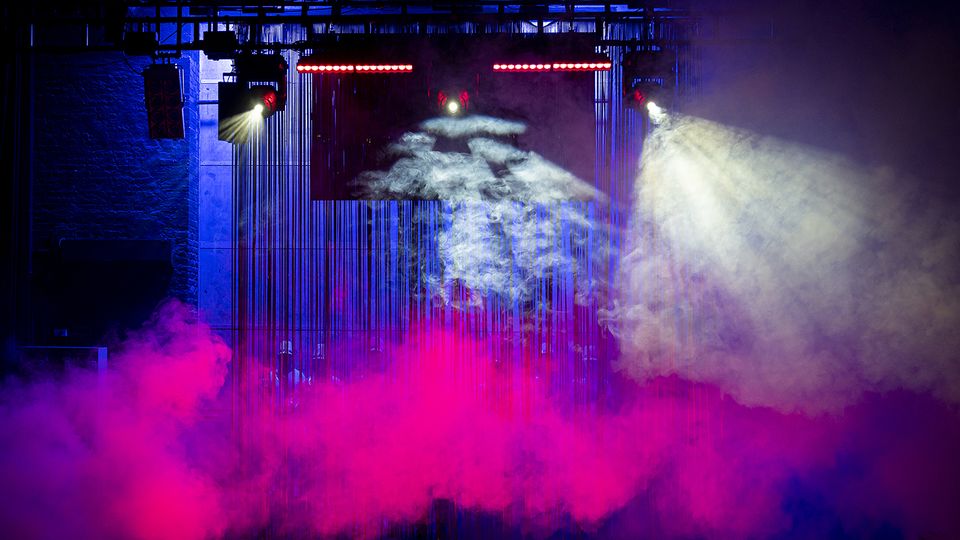 Pink coloured smoke on a stage