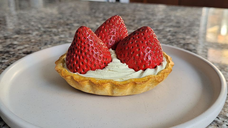 Strawberry tart prop on a plate