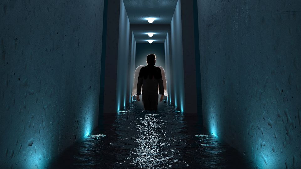 A figure with white wings stands in a flooded dimly lit corridor