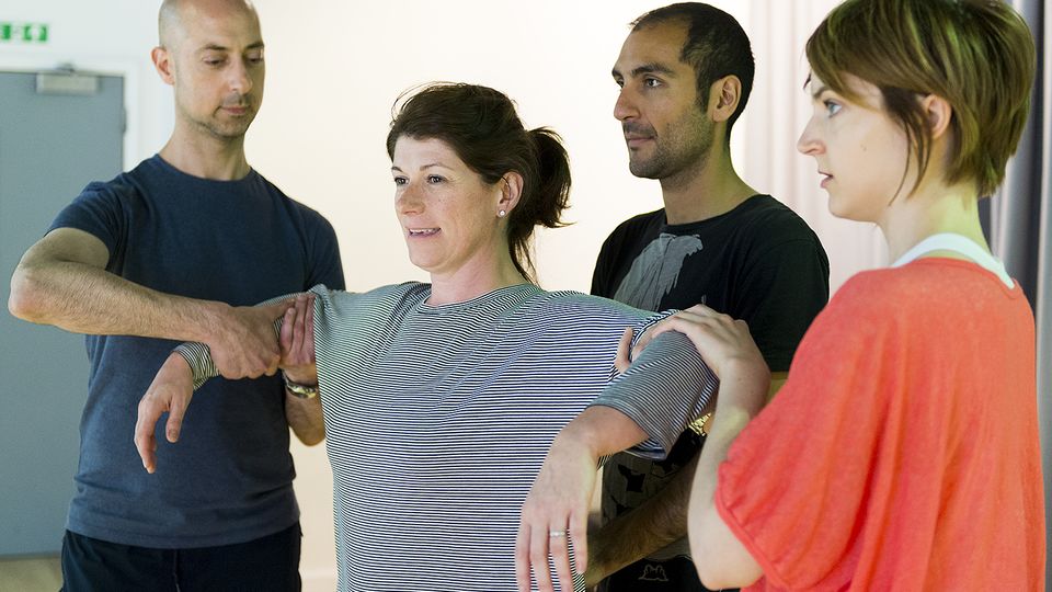 Four Voice Studies students perform an exercise in a workshop