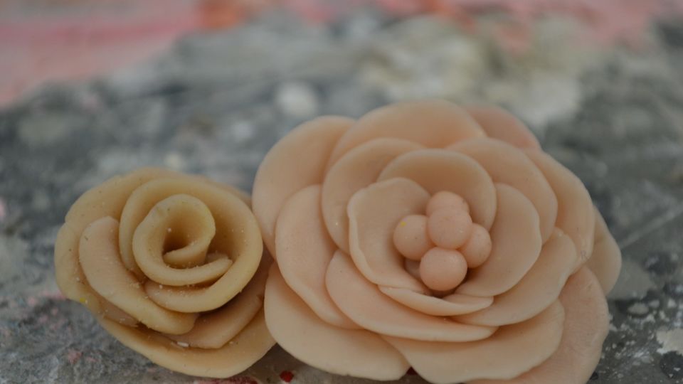 2 moulded flowers placed on tabletop