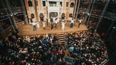 Students performing on stage at Pop-up Globe