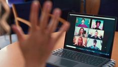 Student participating in an online class with participants via Zoom on a laptop
