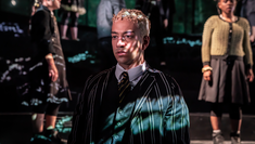 A close up of Nathan Armarkwei-Laryea on stage in Almeida Theatre's Spring Awakening