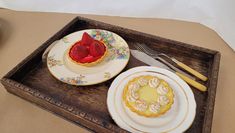 Prop lemon meringue and strawberry tart on a tray 