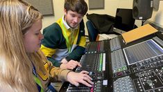 Two students at a sound desk