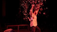 Kim's work as Movement Director on Electra, 2022 at RCCSD. Actor throwing confetti into the air whilst another crawls away from fight 