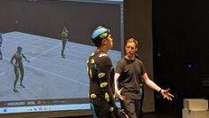 One performer in MOCAP suit guided by tutor