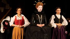 Actors dressed in Elizabethan dress on stage