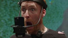 performer in mocap suit with mouth open