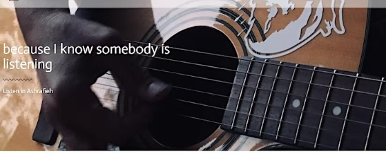 Close up of hand strumming acoustic guitar with text overlaid Because I know somebody is listening