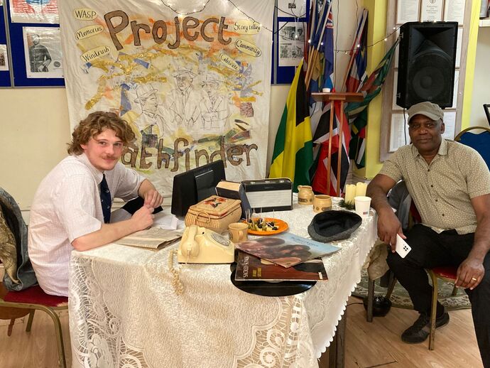 Luca and Norman Bailey at our 'front room' soundscape exhibit on Windrush Day.